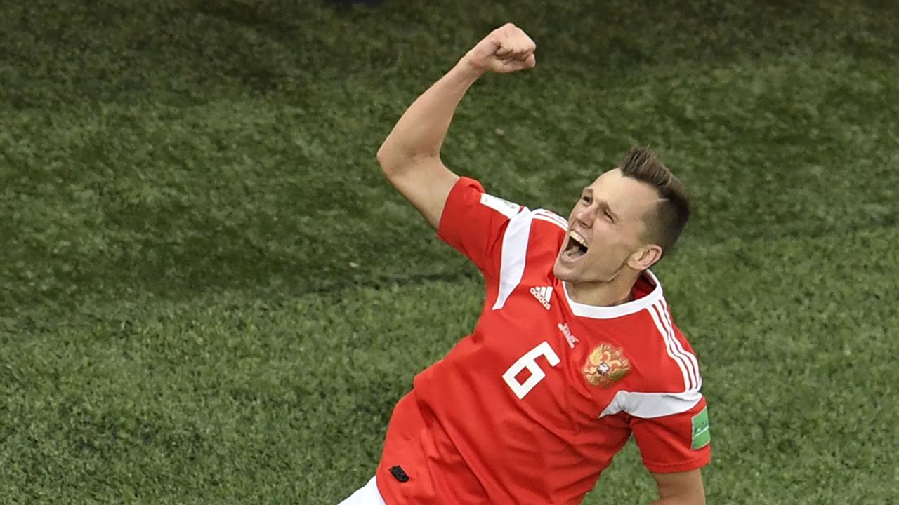 Russia's midfielder Denis Cheryshev celebrates scoring his team's second goal