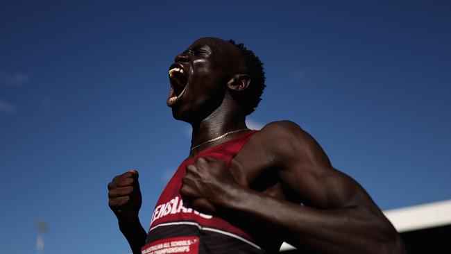 BRISBANE, AUSTRALIA - DECEMBER 06: Gout Gout celebrates after winning his Boys' U18 100m final during the 2024 Chemist Warehouse Australian All Schools Athletics Championship at Queensland Sport and Athletics Centre on December 06, 2024 in Brisbane, Australia. At 16 years of age, Australian sprinter Gout Gout has been breaking records in the 100m and 200m. At the Australian All Schools Athletics Championship Gout ran a 10.04 second heat with a tail wind and won the final in a legal 10.17 seconds. In the 200m final he ran an Australian National record of 20.04 seconds, breaking a 56 year old national record set by Peter Norman at the 1968 Mexico Summer Olympics. (Photo by Cameron Spencer/Getty Images)