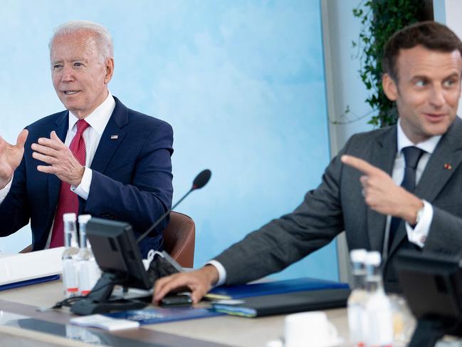 US President Joe Biden listens as France's President Emmanuel Macron speaks at a working session during the G7 summit. Picture: AFP