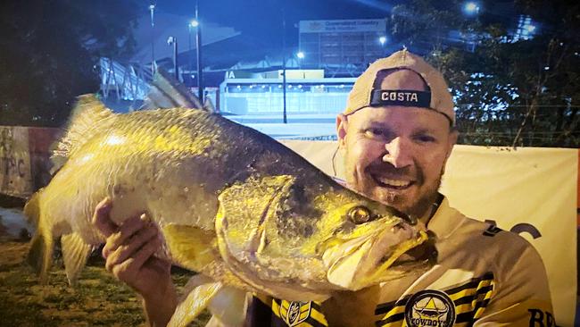 Martin Price with a good sized barramundi outside Queensland Country Bank Stadium.