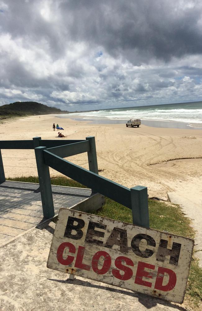 Warning... A Beach Closed sign at the spot where the man was taken.