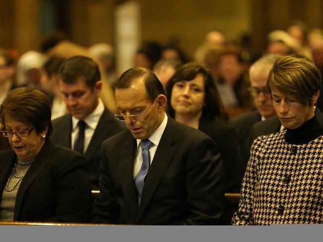 A softer side: Prime Minister Tony Abbott shows both strength and compassion for those impacted by the downing of MH17. Picture: Attila Szilvasi.