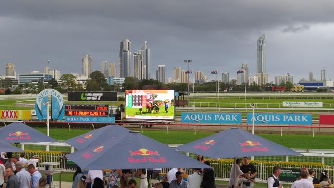 Revellers enjoying Melbourne Cup at the Gold Coast Turf Club. Only a few drops of rain fell.