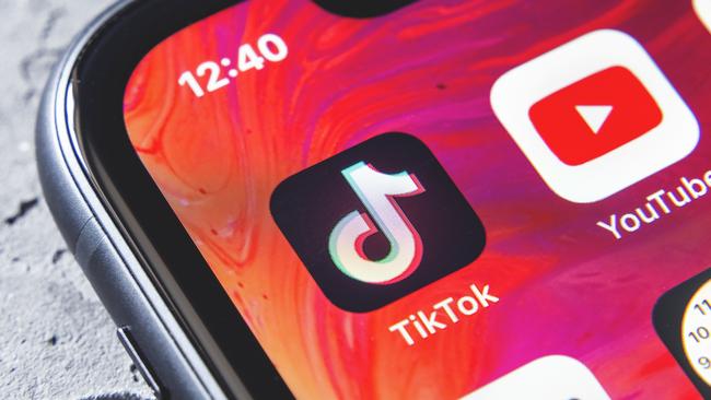 TikTok and YouTube apps on screen iphone xr, close up