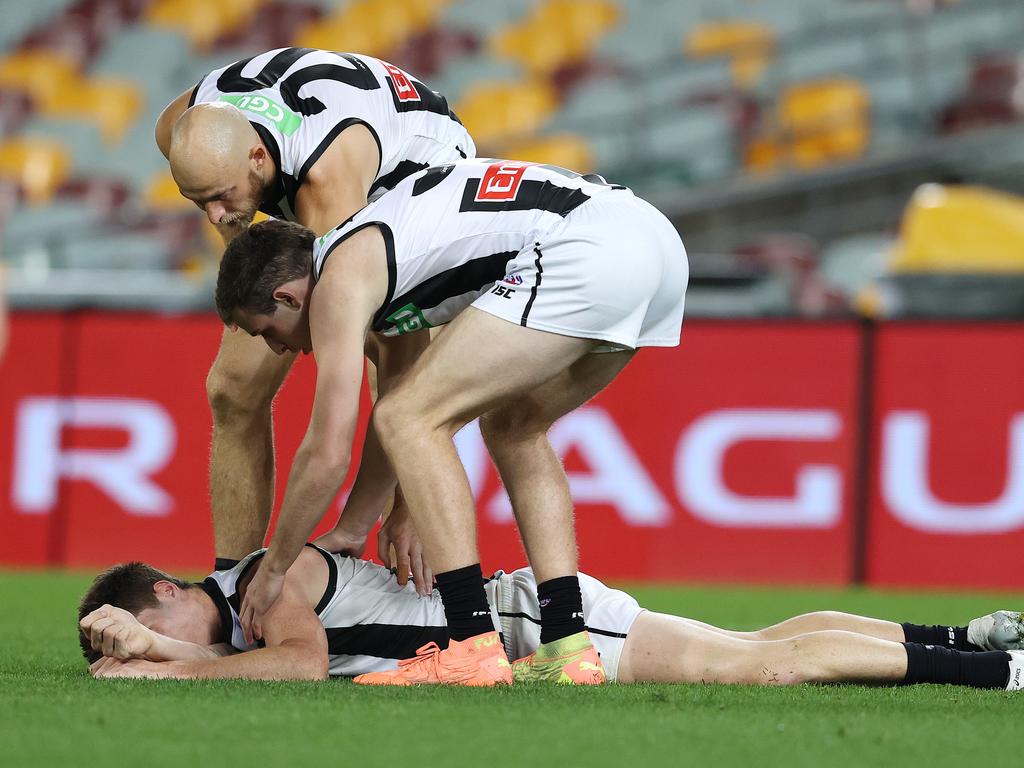 Brody Mihocek lies on the ground after he collided with Aaron vandenBerg.