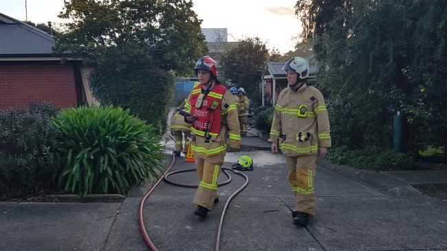 Firefighters at the scene of a unit fire in Montgomery St, Ringwood. Picture: Kiel Egging