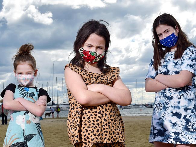 MELBOURNE, AUSTRALIA : AUGUST 21ST 2021 - Kids are expected to wear masks under the state of Victoria's strictest restrictions yet.Zara, 7, Frankie, 7 and Sophie, 11, wearing their masks to adhere to the new COVID recommendations.Picture : Nicki Connolly