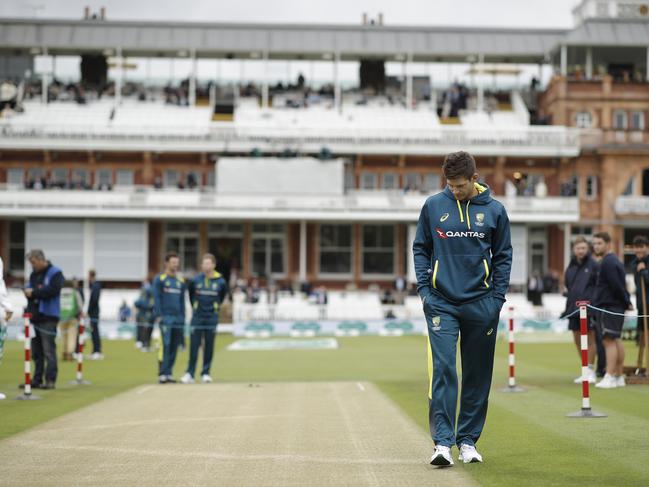 Tim Paine inspects the pitch as rain delays the start of play during the Lord’s Test. Picture: Ryan Pierse/Getty Images