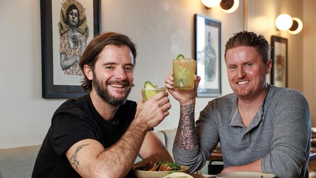 Mark Crawford and Michael Fegent at Tequila Mockingbird, in Paddington, which is marking it's 7th birthday by giving away prizes for fans with a tattoo of the restaurant. Picture: Justin Lloyd.