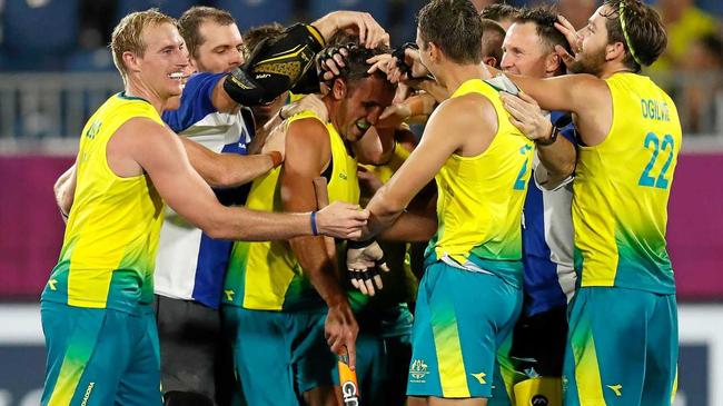 Mark Knowles celebrates with teammates after winning the gold medal match. Picture: Michael Willson
