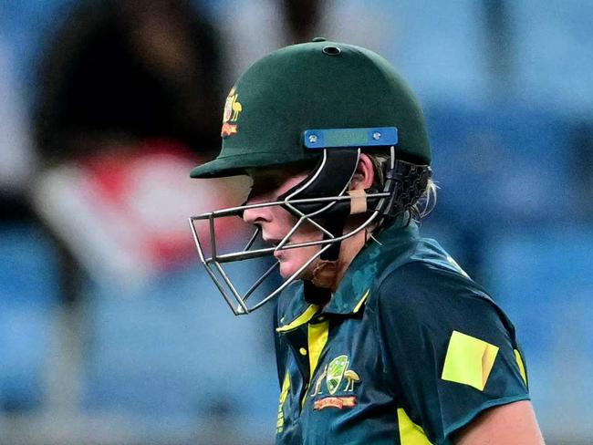 Australia's Beth Mooney walks back to the pavilion after her dismissal during the ICC Women's T20 World Cup cricket semi-final match between Australia and South Africa at the Dubai International Cricket Stadium in Dubai on October 17, 2024. (Photo by Giuseppe CACACE / AFP)