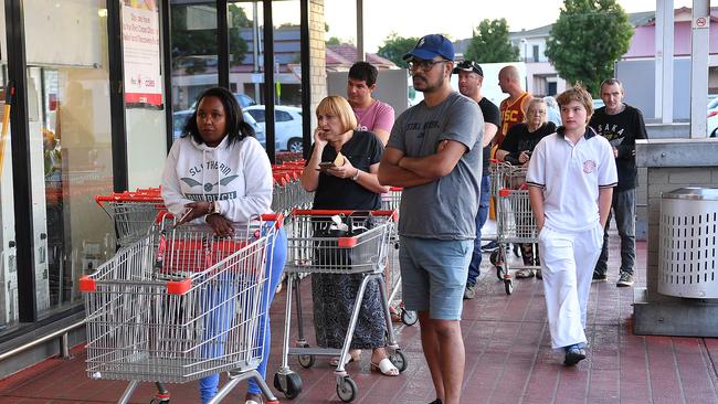 Shoppers line up ready to enter the Kurralta Park Coles as soon as the first hour, which is open only to the elderly and those with disabilities, finishes. Picture: AAP/Mark Brake