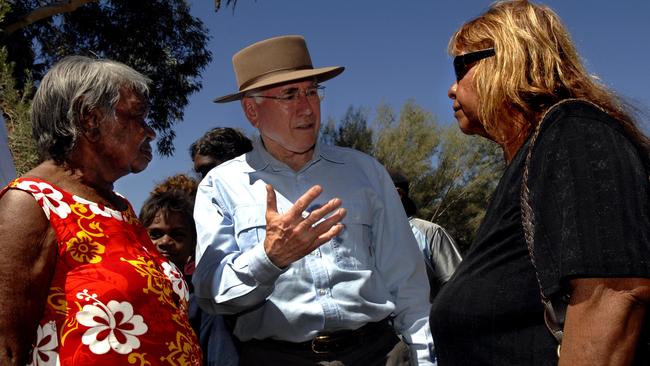 Prime Minister John Howard meets locals during al visit to the Northern Territory Indigenous community of Hermannsburg, 125km west of Alice Springs.