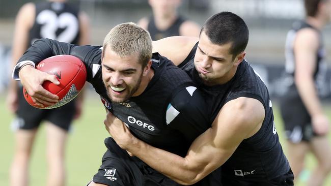 Ryan Burton (right) won’t be rushed back into the Power’s line-up. Picture: Sarah Reed