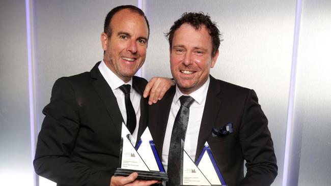 Grant McArthur (right), with photographer Alex Coppel, wins awards and fights crime. Picture: Christian Gilles