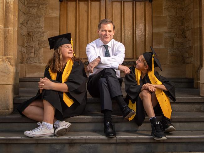 SA Weekend. University of Adelaide Vice-Chancellor and President Professor Peter Rathjen AO, with Children's University Australia students Molly 11 and Miller 9 Scott in Bonython Hall. Picture: Brad Fleet