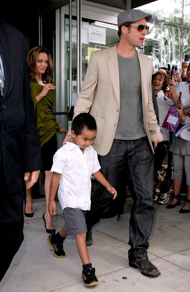 Angelina Jolie, Maddox Jolie-Pitt and Brad Pitt walk past a waiting crowd on September 12, 2007 in New York City. Picture: Getty