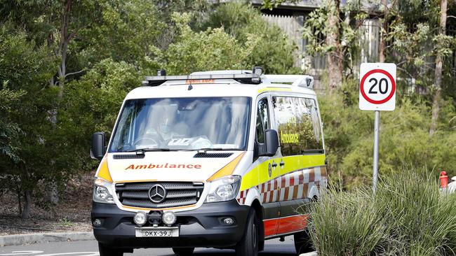 An ambulance leaves Newmarch House on Friday after a thirteenth death was recorded overnight. Picture: Nikki Short