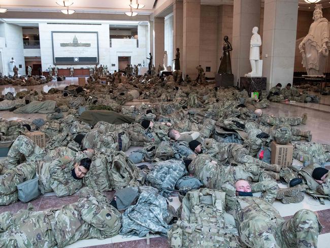 Members of the National Guard rest in the Capitol Visitors Center ahead of the Inauguration. Picture: AFP