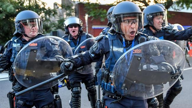 Police in riot gear charge at protesters at the protest outside the Milo Yiannopoulos event. Picture: Jake Nowakowski