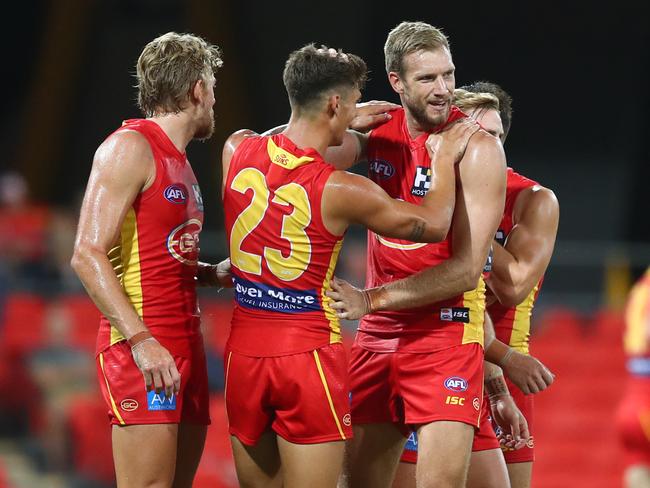 Sam Day of the Suns celebrates a goal during the 2020 Marsh Community AFL Series match between the Gold Coast Suns and the Geelong Cats at Metricon Stadium on February 22, 2020 in Gold Coast, Australia. (Photo by Chris Hyde/Getty Images)