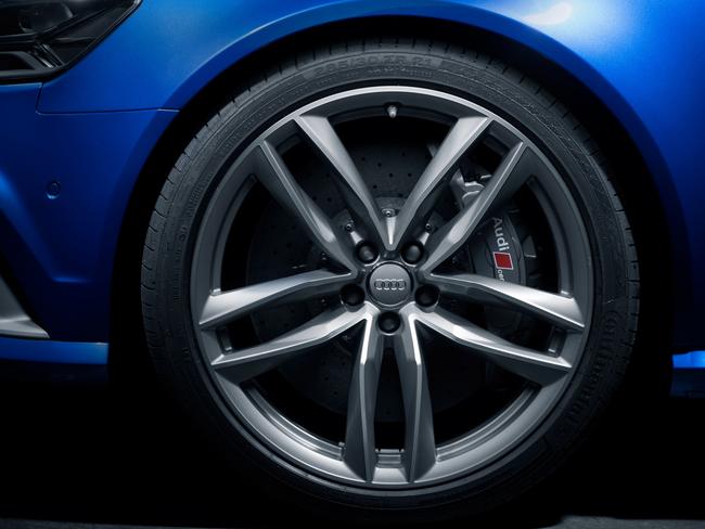 Audi RS badge and wheel reflect the brand's history and heritage.