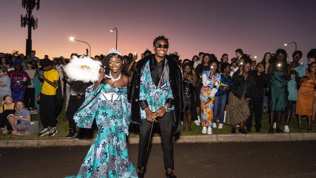 Irenne Kininga and Jacques Nikodemu Ntambwe arrive at Harristown State High School formal at Highfields Cultural Centre, Friday, November 18, 2022. Picture: Kevin Farmer