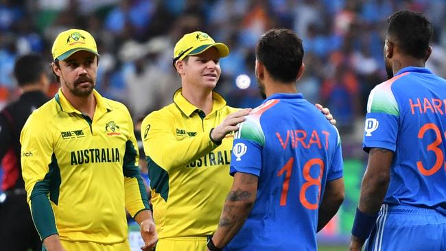 Steve Smith congratulates Virat Kohli. Picture: Ryan Lim / AFP