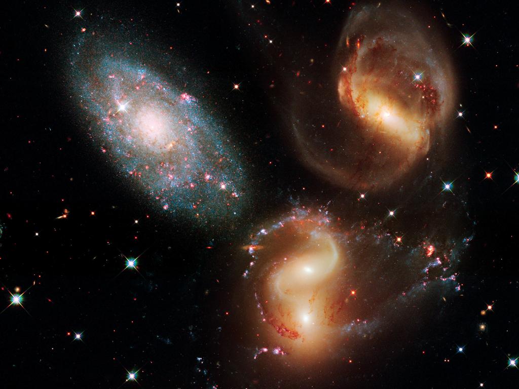 Three of the galaxies in this famous grouping, Stephan’s Quintet, are distorted from their gravitational interactions with one another. One member of the group, NGC 7320 (upper right), is actually seven times closer to Earth than the rest.