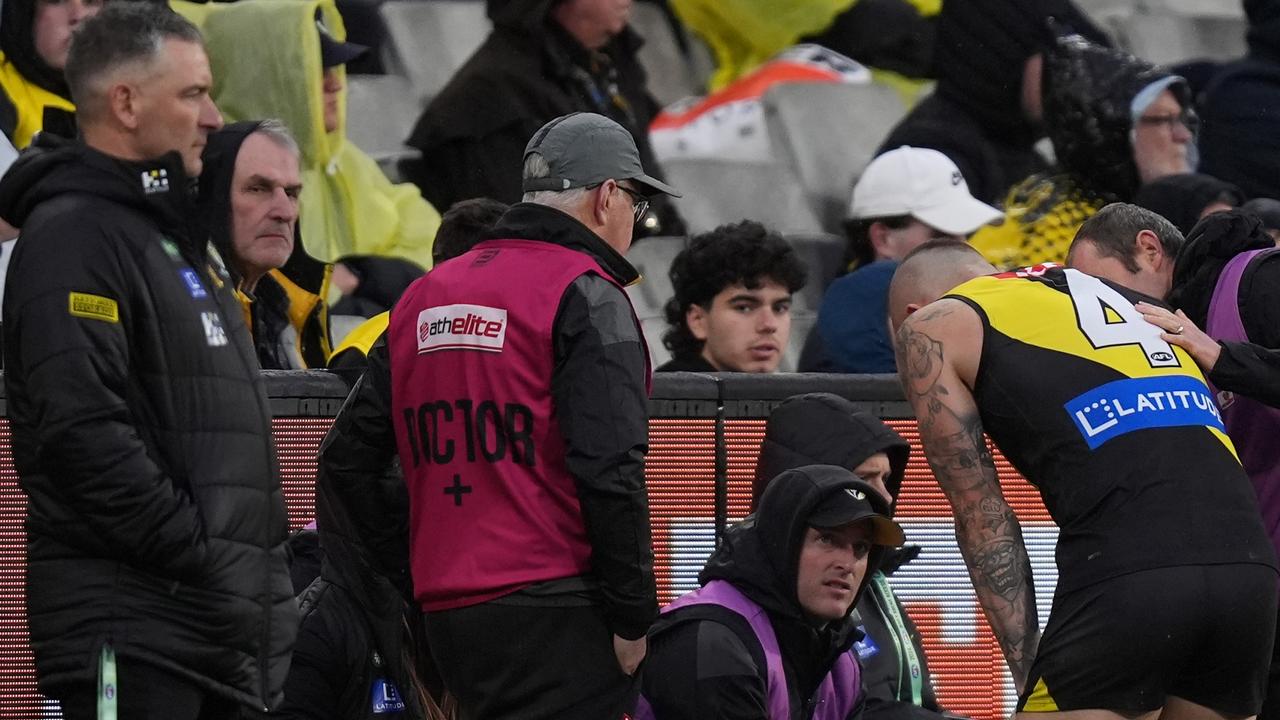 First-year Richmond coach Adem Yze (left) says it was clear Dustin Martin (right) was carrying a heavy burden as he decided on his future this season. Picture: Daniel Pockett / Getty Images