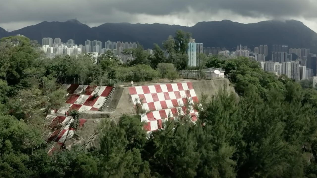 To help with the landing, they would look for Checkerboard Hill where they would have to make a 47-degree right turn to line up with the runway. Picture/YouTube/South China Morning Post