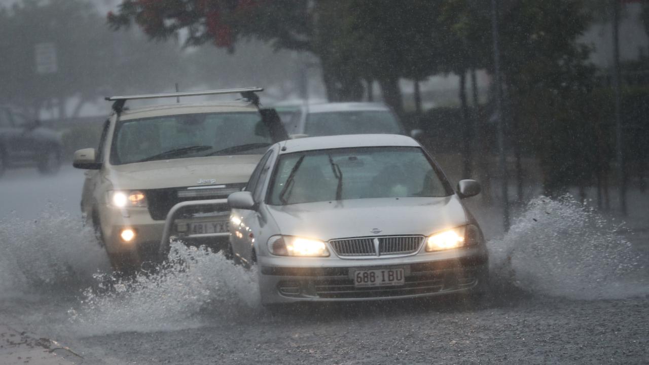 Motorists on Queen St in Southport after a storm lashes the Gold Coast. Photograph : Jason O’Brien