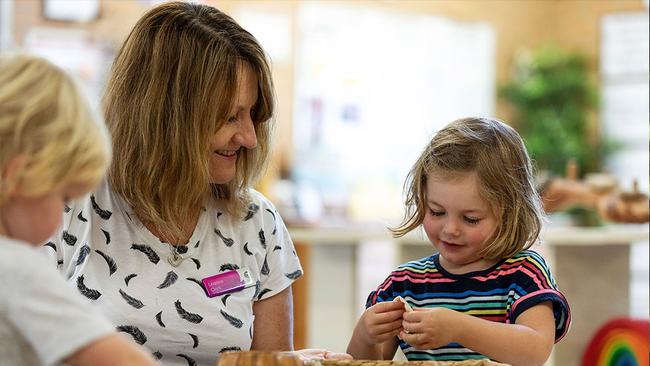 A staff member with children playing at Northern Beaches Council's Brookvale Children's Centre. Picture: Northern Beaches Council