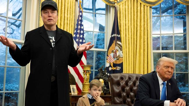 Mr Musk (and one of his sons) with Mr Trump during their previous joint appearance, a press conference in the Oval Office. Picture: Jim Watson/AFP