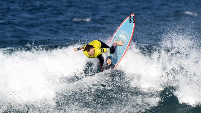 Carly Shanahan in the quarter finals of the Woolworths NSW Junior Surfing Titles in Coffs Harbour.