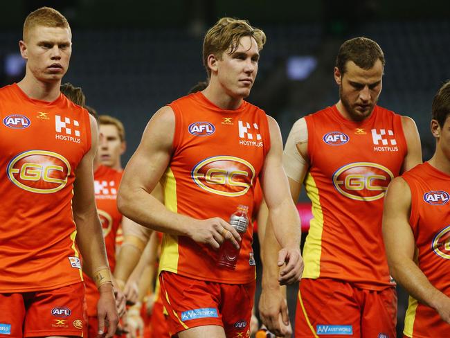 MELBOURNE, AUSTRALIA - JUNE 25:  Tom Lynch of the Suns (C) looks dejected after defeat during the round 14 AFL match between the St Kilda Saints and the Gold Coast Suns at Etihad Stadium on June 25, 2017 in Melbourne, Australia.  (Photo by Michael Dodge/Getty Images)