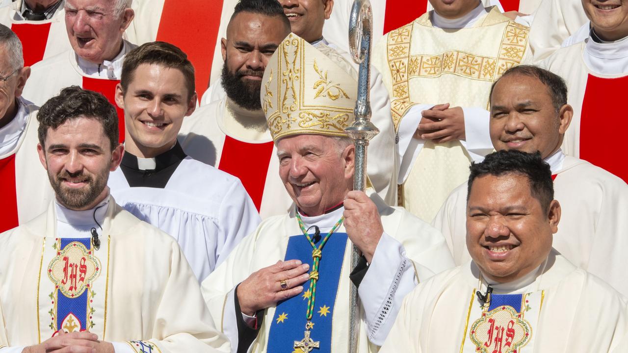 Ordination of Nathan Webb (left) and Brian Redondo (right) with Bishop Robert McGuckin at St Patrick’s Cathedral. Picture: Nev Madsen.