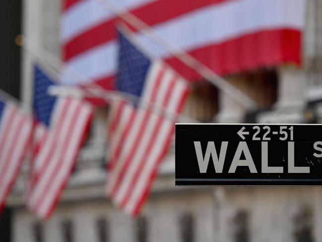 View of the New York Stock Exchange (NYSE) at Wall Street on November 16, 2020 in New York City. - Wall Street stocks rose early following upbeat news on a coronavirus vaccine and merger announcements in the banking and retail industries. (Photo by Angela Weiss / AFP)