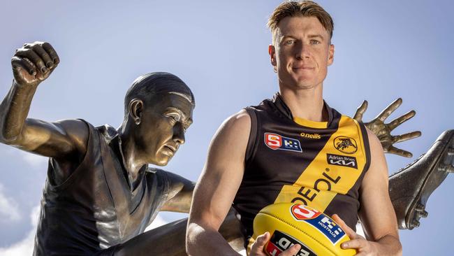 Glenelg’s Lachie Hosie alongside the Ken Farmer Statue at Adelaide Oval after claiming his first Ken Farmer Medal as SANFL leading minor round goalkicker. Picture: Emma Brasier