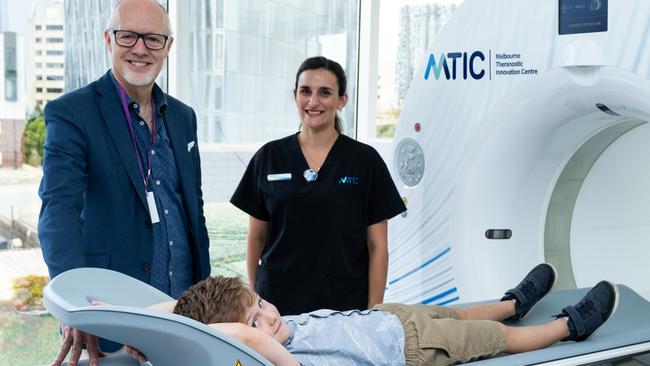 Lachlan checks out the new Quadra scanner with Professor Rod Hicks and technician Melissa Munro. Picture: Martin Wood