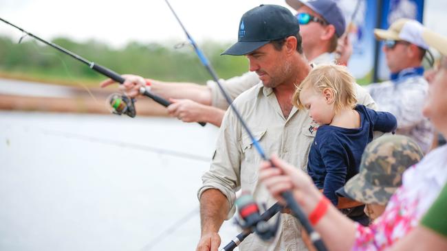 Matt Wright and son Banjo had the chance to catch a charity fish. Picture Glenn Campbell