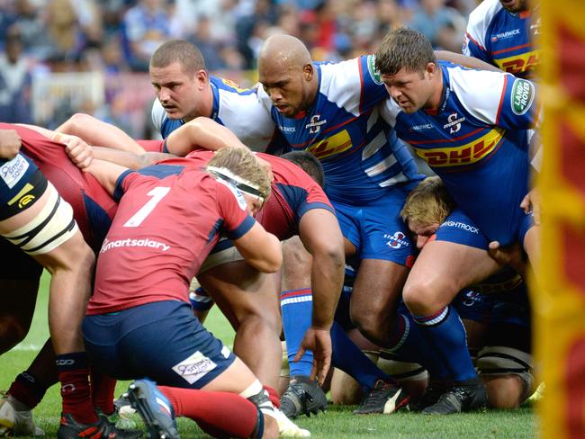 Queensland Reds and Stormers pack for a scrum during their enthralling contest. Picture: AFP