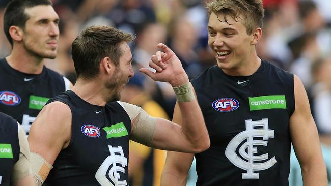 Dale Thomas and Patrick Cripps have a laugh after the siren. Picture: Wayne Ludbey