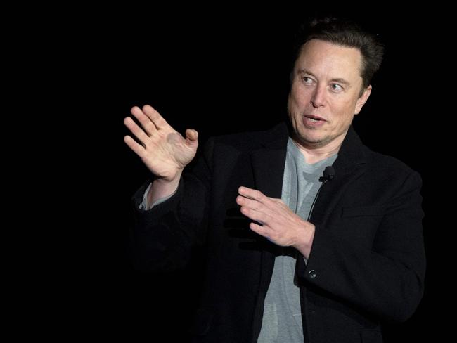 (FILES) In this file photo taken on February 10, 2022 Elon Musk gestures as he speaks during a press conference at SpaceX's Starbase facility near Boca Chica Village in South Texas. - Twitter suspended December 15, 2022, the accounts of more than a half-dozen journalists who had been writing about the company and its new owner Elon Musk. Some of the journalists had been tweeting about Twitter shutting down an @ElonJet account that tracked flights of the billionaire's private jet and about versions of that account hosted at other social networks. (Photo by JIM WATSON / AFP)