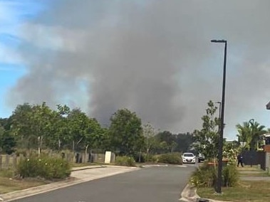 A fire at Little Mountain, pictured from Adelaide Circuit looking towards Baringa State Secondary College, has prompted a school evaucation.