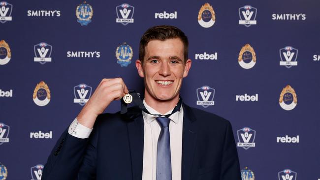 Ethan Phillips with the 2022 Fothergill-Round-Mitchell Medal. Picture: Dylan Burns/AFL Photos via Getty Images