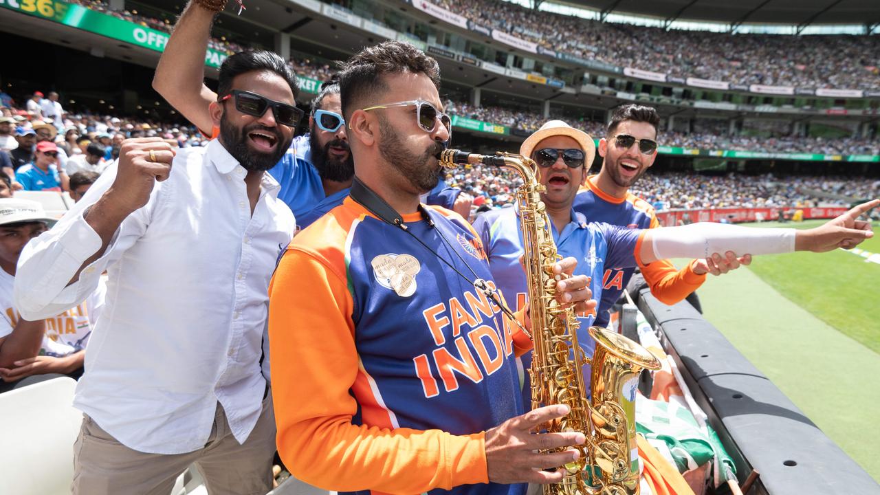 Indian fan Manujul Sharma plays the saxophone for a packed section of supporters at the MCG. Picture: Tony Gough