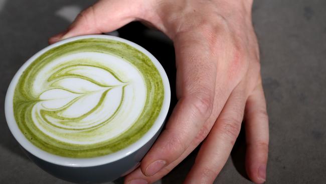 Reid Mitchell prepares Matcha Green tea, which has become a new trend in cafes, served at Raw Espresso, Southport, Gold Coast.