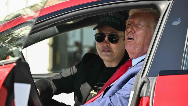 Mr Trump flogging Teslas with Elon Musk in front of the White House today. Picture: Mandel Ngan/AFP