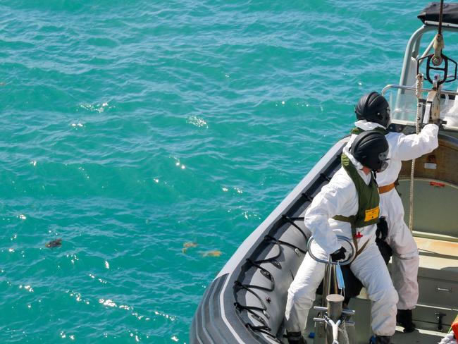 Royal Australian Navy sailors from HMAS Brisbane prepare to board a Rigid-Hulled Inflatable Boat to conduct search and rescue operations in the vicinity of Lindeman Island, Queensland, 29 July 2023. A multi-national and multi-agency search and rescue effort is underway following an Australian Army MRH-90 Taipan helicopter impacting waters near Lindeman Island on the night of 28 July 2023 during Exercise Talisman Sabre 23. *** Local Caption *** Exercise Talisman Sabre 2023 is being conducted across northern Australia from 22 July to 4 August.    More than 30,000 military personnel from 13 nations will directly participate in Talisman Sabre 2023, primarily in Queensland but also in Western Australia, the Northern Territory and New South Wales.     Talisman Sabre is the largest Australia-US bilaterally planned, multilaterally conducted exercise and a key opportunity to work with likeminded partners from across the region and around the world.    Fiji, France, Indonesia, Japan, Republic of Korea, New Zealand, Papua New Guinea, Tonga, the United Kingdom, Canada and Germany are all participating in Talisman Sabre 2023 with the Philippines, Singapore and Thailand attending as observers.    Occurring every two years, Talisman Sabre reflects the closeness of our alliance and strength of our enduring military relationship with the United States and also our commitment to working with likeminded partners in the region.    Now in its tenth iteration, Talisman Sabre provides an opportunity to exercise our combined capabilities to conduct high-end, multi-domain warfare, to build and affirm our military-to-military ties and interoperability, and strengthen our strategic partnerships. Picture: NCA NewsWire / Australian Defence Imagery